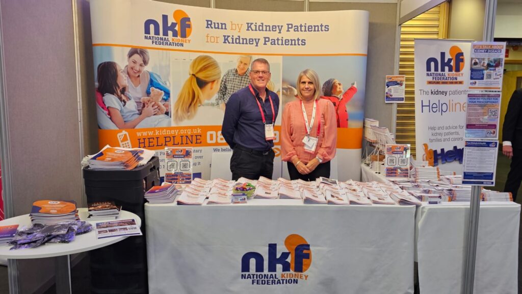 A woman and a man at an exhibition stand