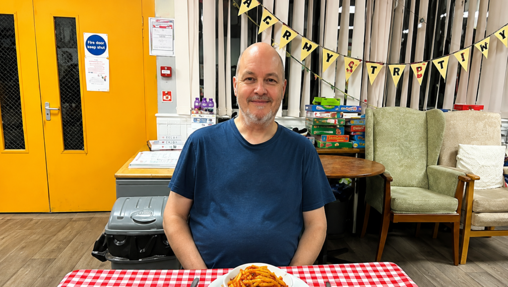 A man at a FoodCycle table