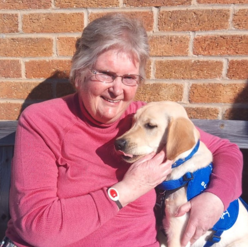 A woman with a support dog