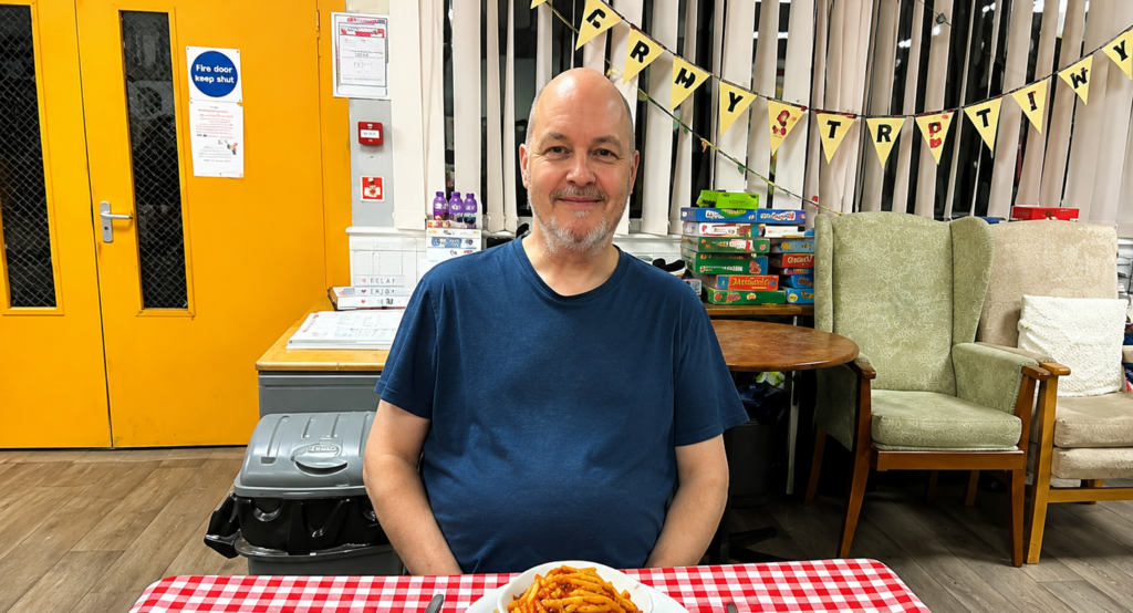 A man at a FoodCycle table