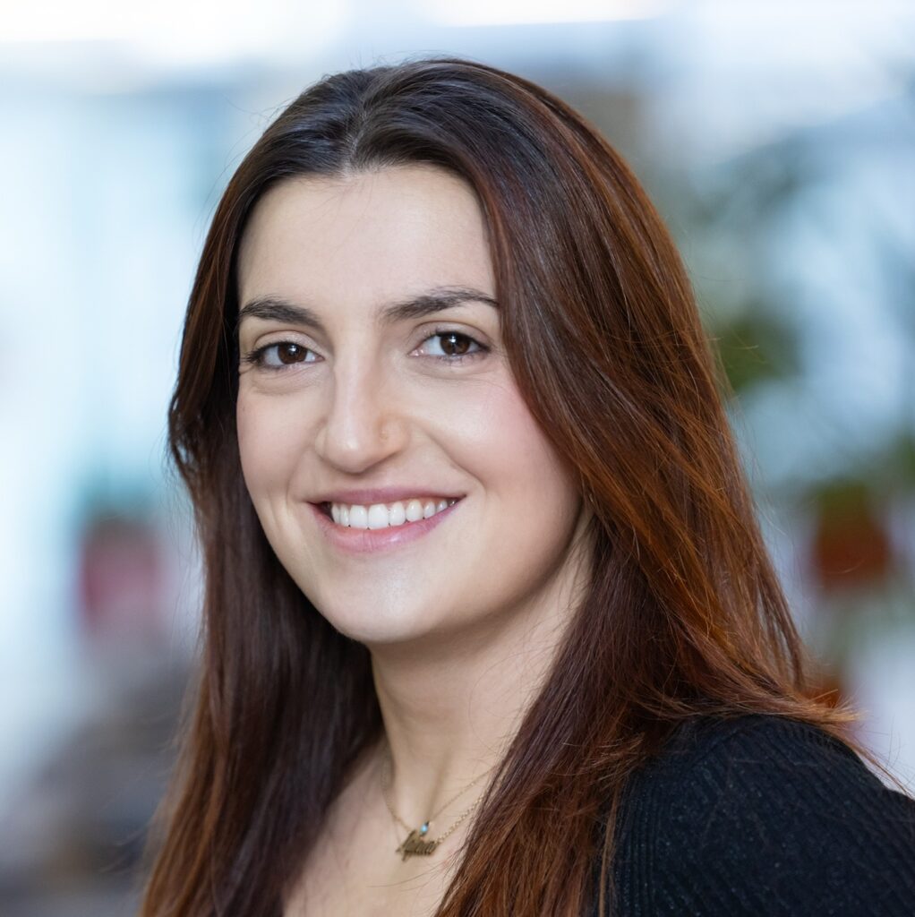 A portrait image of a woman with long hair
