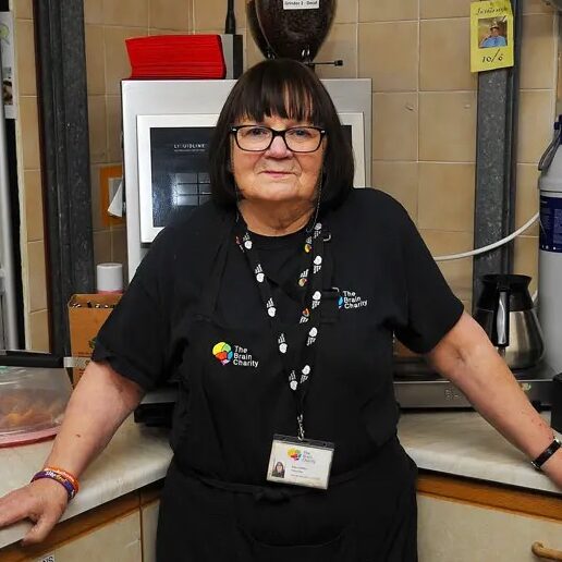 Portrait photo of a woman in a cafe kitchen