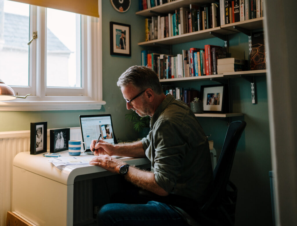 A man works on a laptop